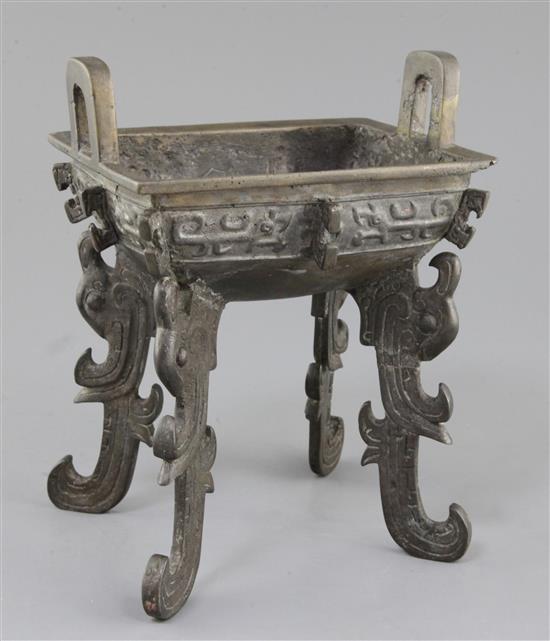 A Chinese archaic bronze quadruped ritual food vessel, Fangding, early Western Zhou dynasty, 22.7cm high, 17.5cm wide, repairs and lack